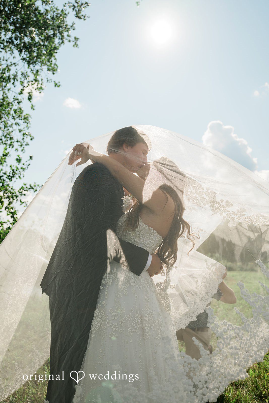 The couple shares a kiss