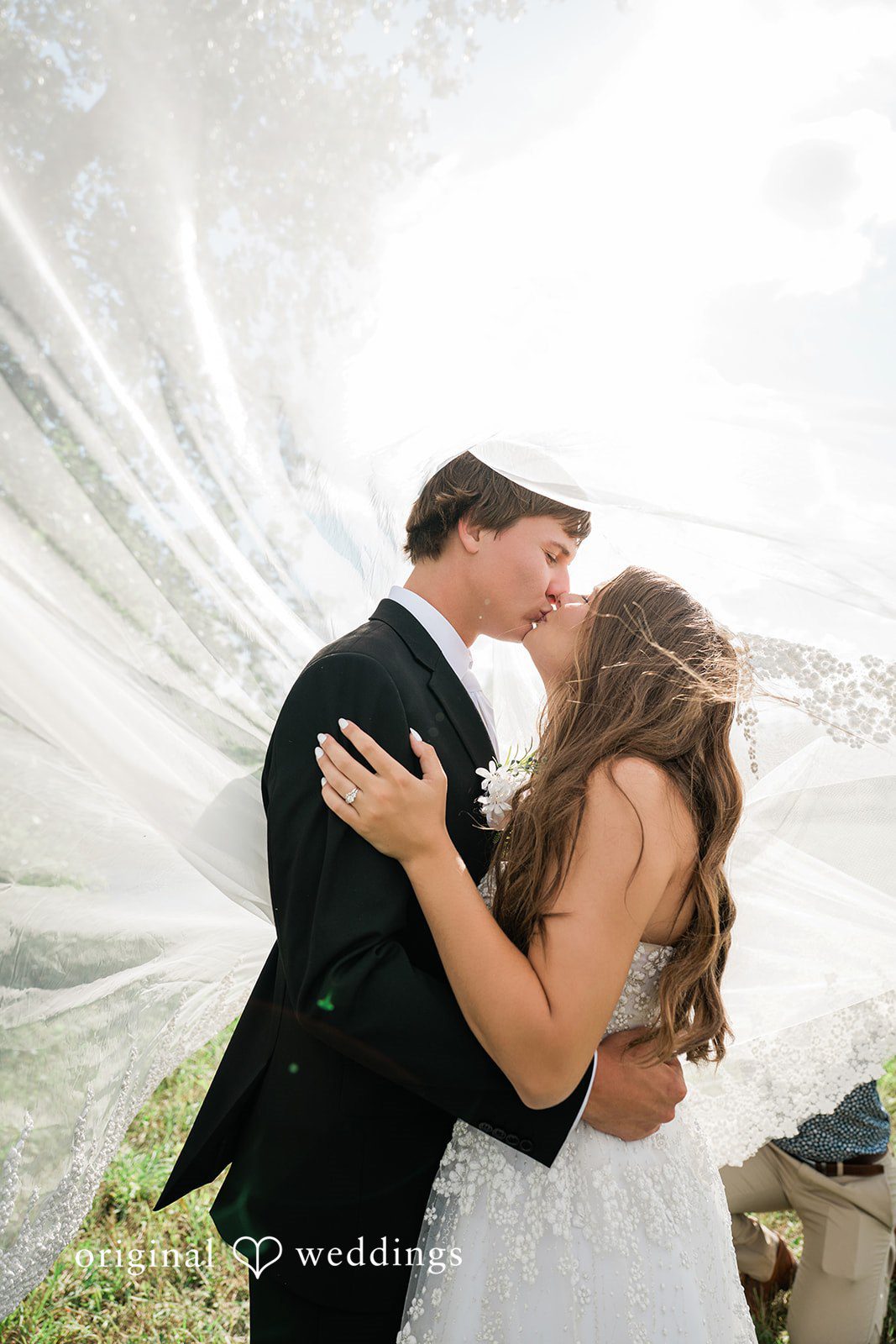 The couple shares a kiss