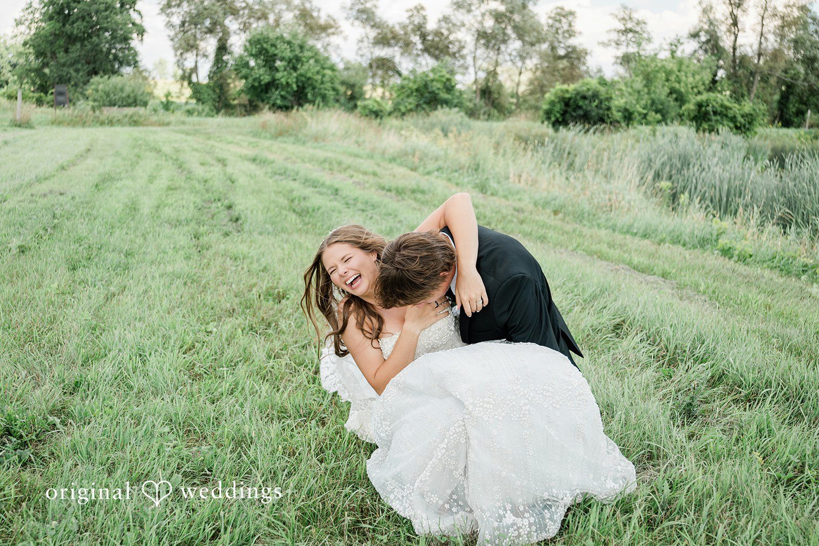 The couple shares a playful moment outdoors