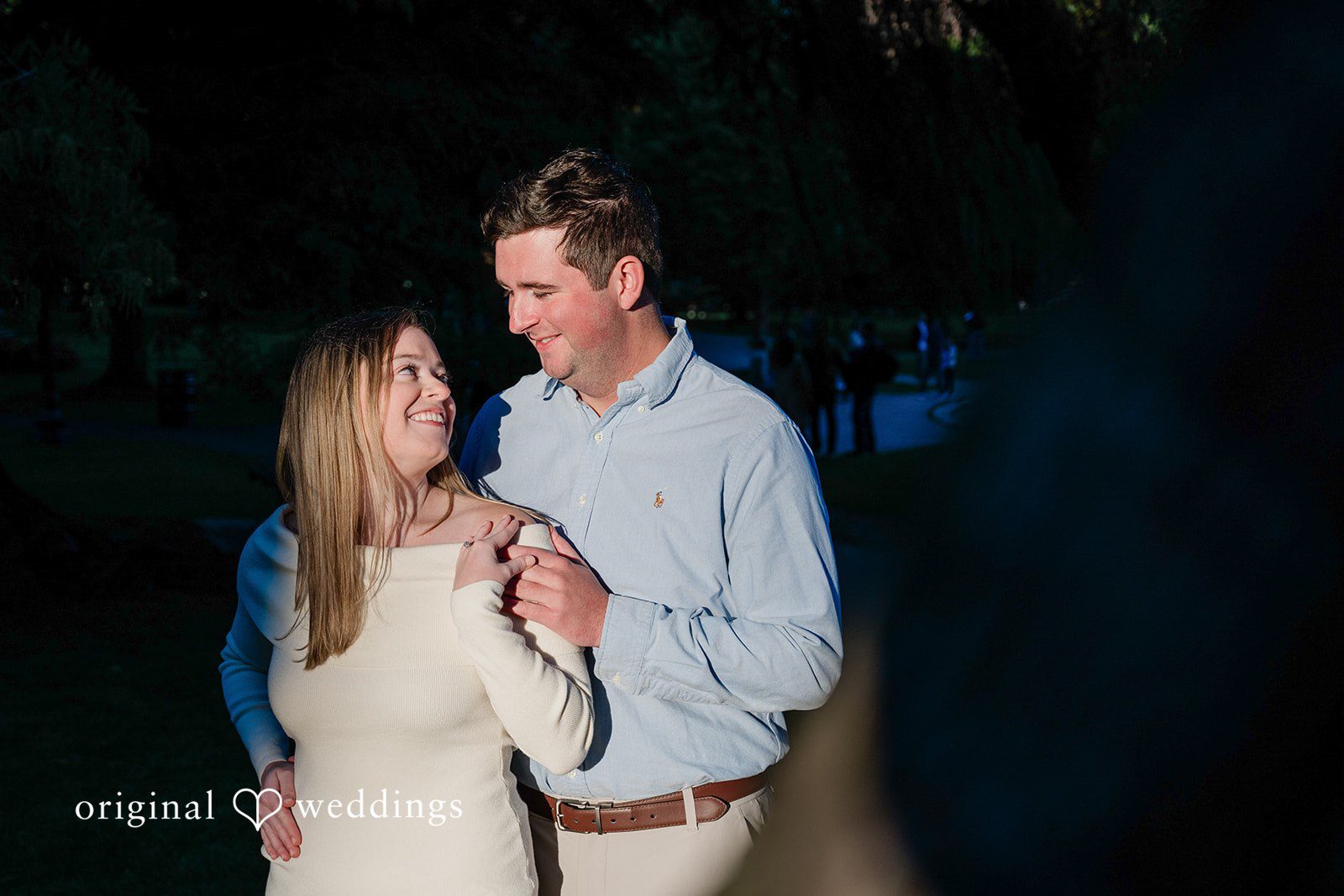 October 06, 2026 – Alice & Austin – (ID-6084) Couple smiling at each other in soft evening light, Engagement Photography Services by Original Weddings at Boston Public Garden