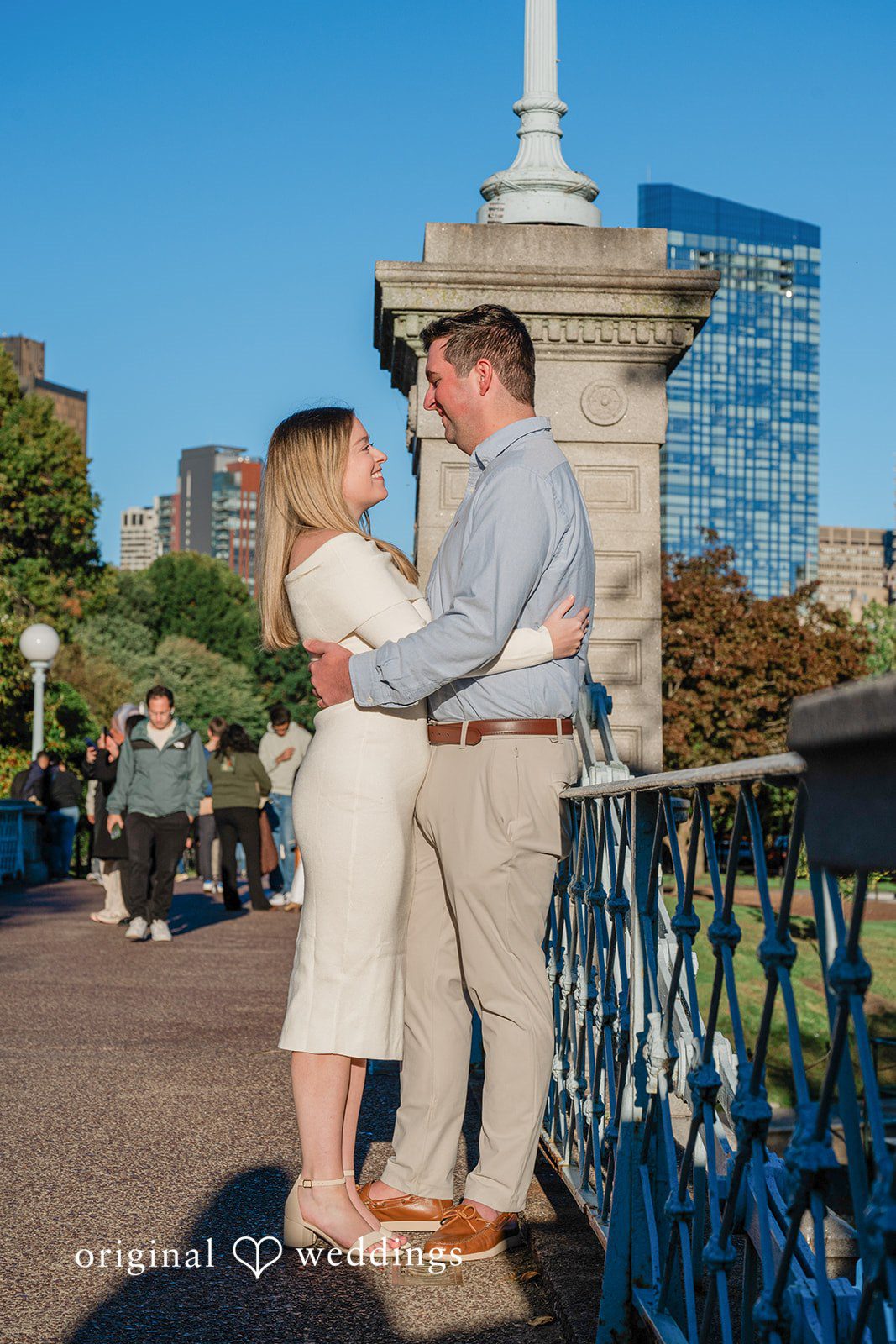 October 06, 2026 – Alice & Austin – (ID-6084) Couple posing on the bridge with the city skyline at Boston Public Garden