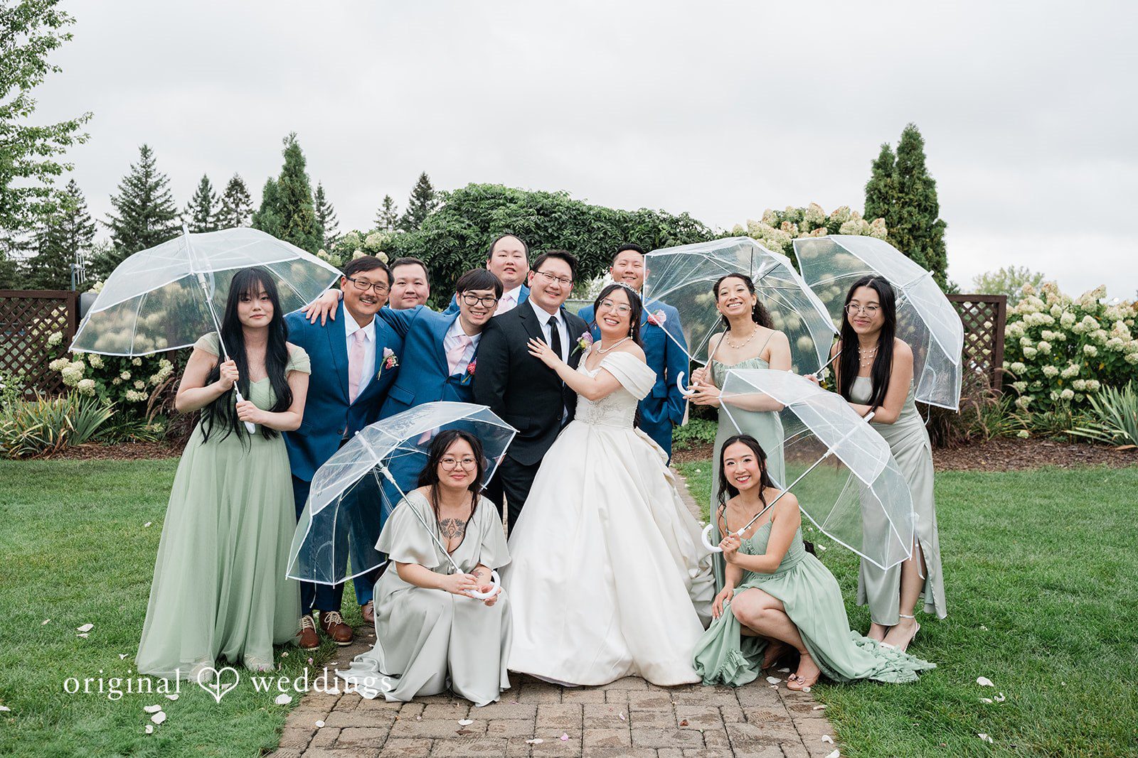 Josouaedh + Naochue Our Minneapolis wedding photographers at Original Weddings captured a stunning portrait of the couple and their bridal party at Brackett's Crossing Country Brackett's Crossing Country Club