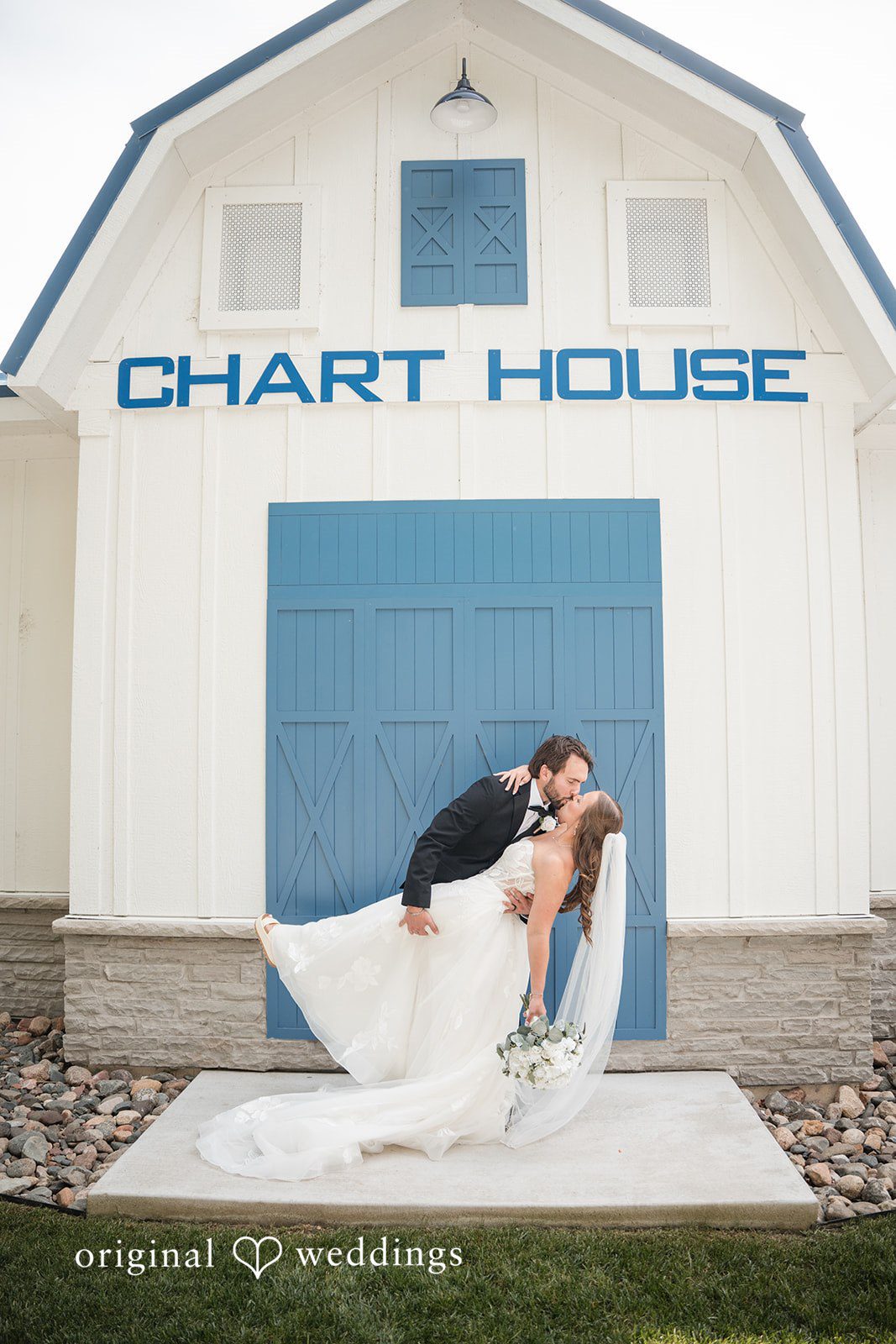Couple at the Chart House sign