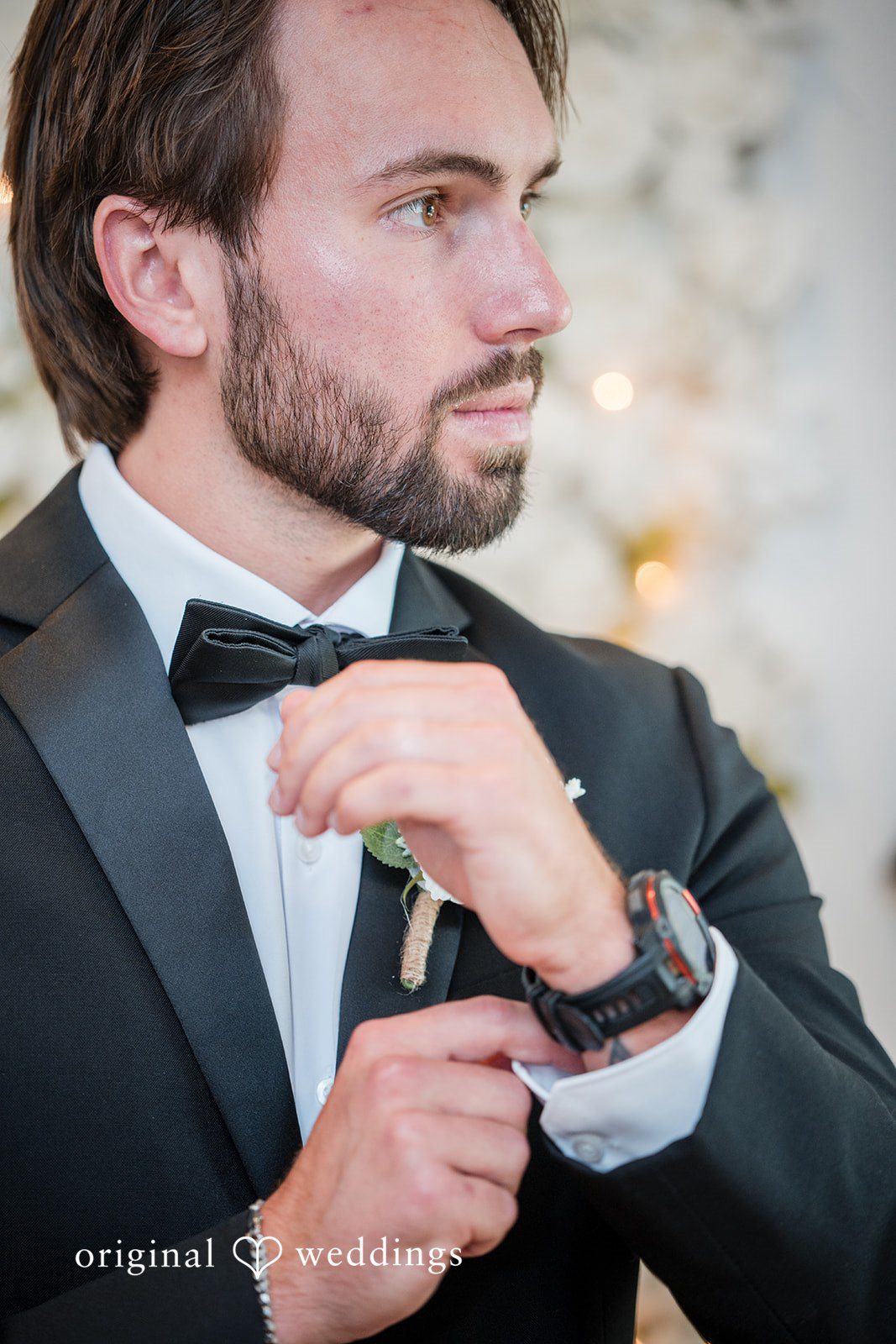 Groom fixing his cufflinks
