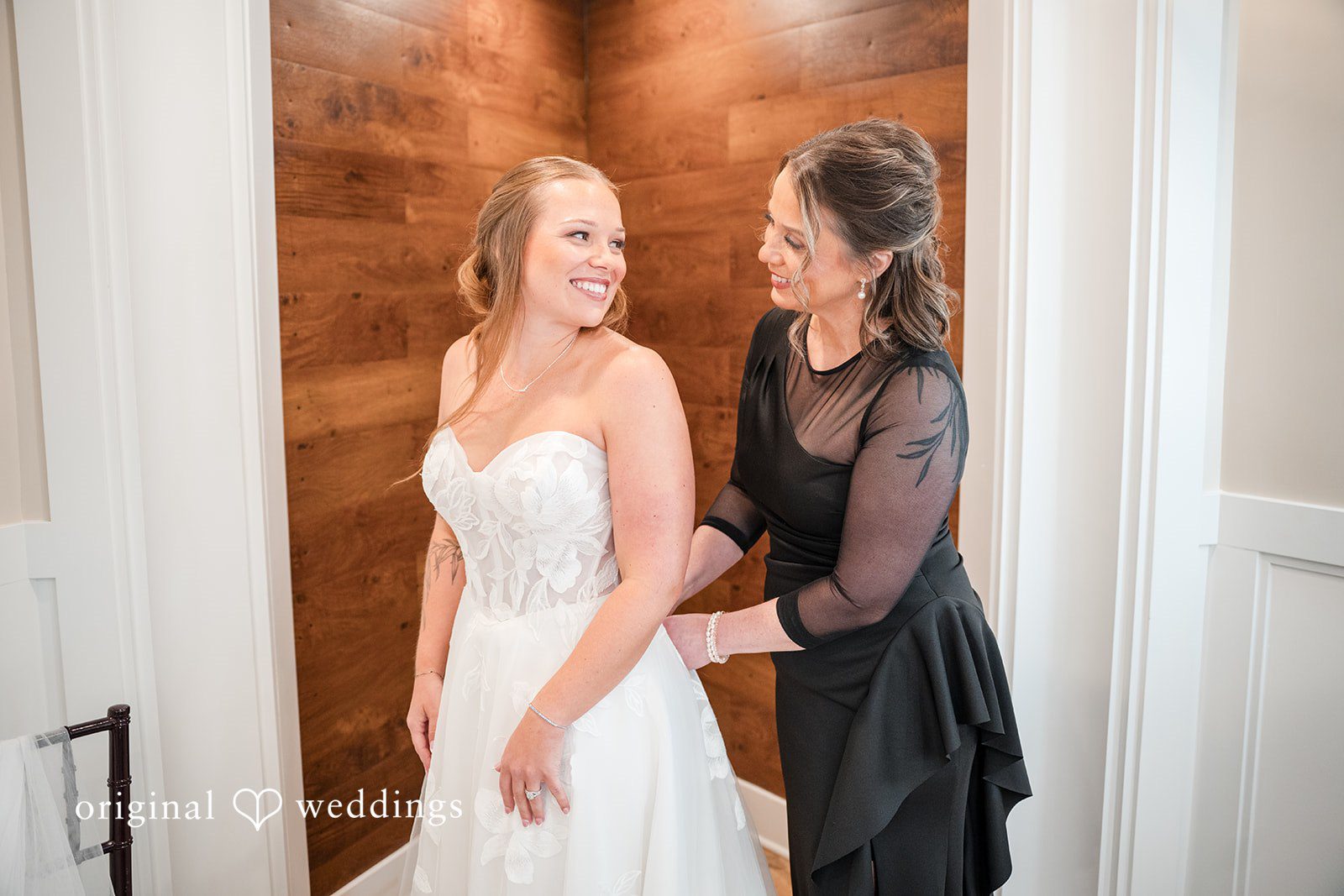 Bride getting ready with her mom at Brianos Charthouse Lakeville