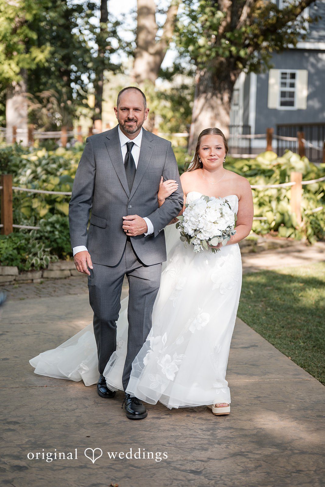 Father walking the bride down the aisle