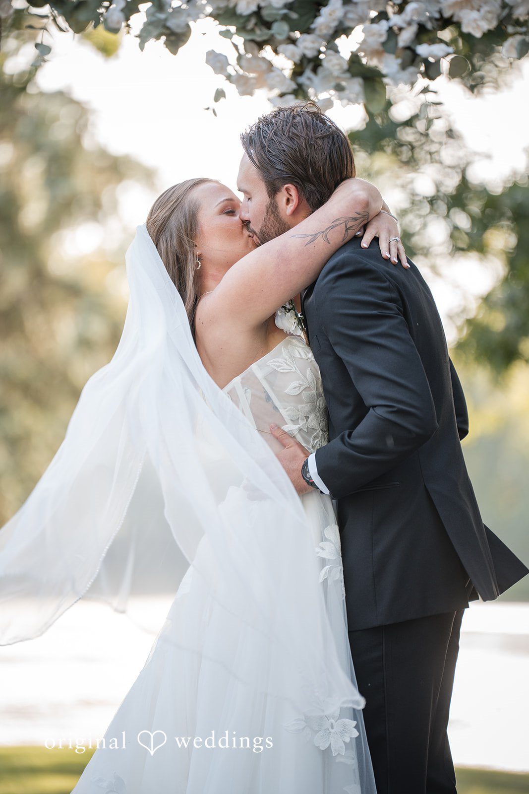 Couple kissing in the veil