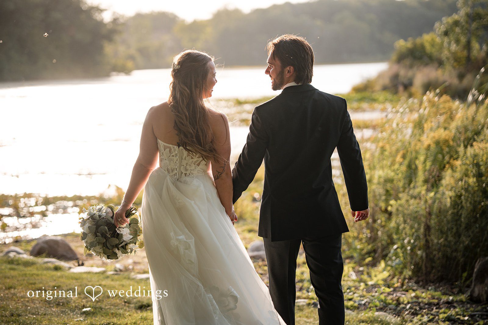 Couple walking by the lake at Brianos Charthouse Lakeville