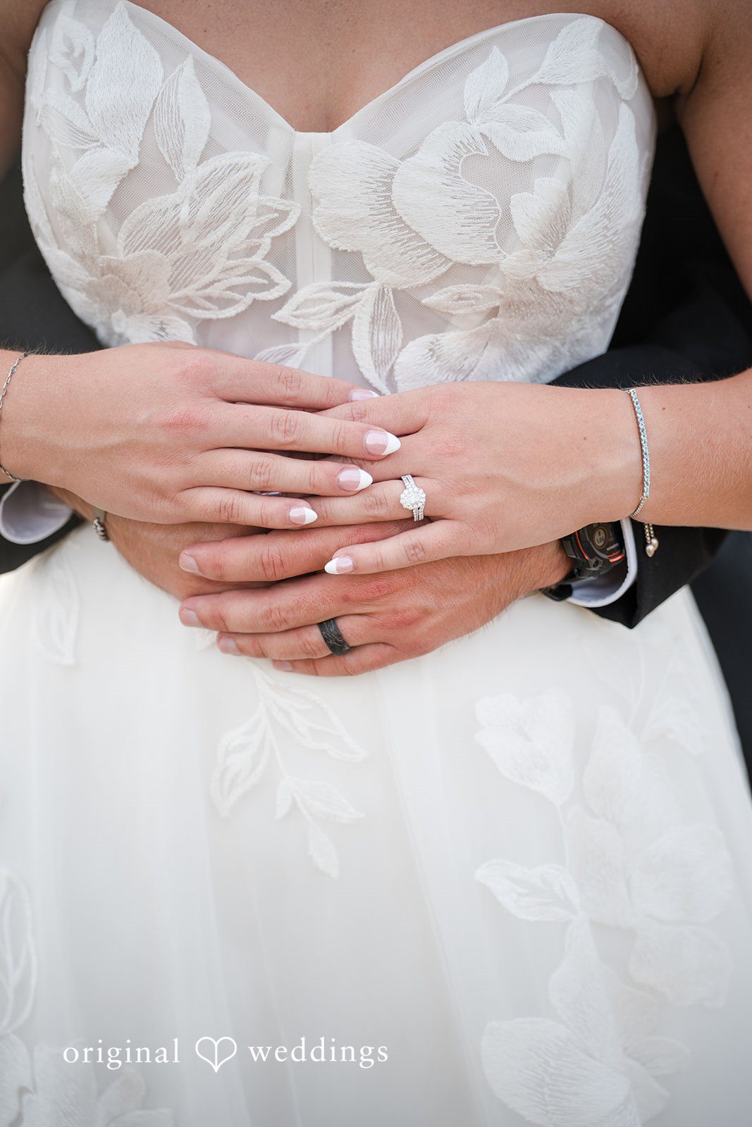 Bride's hands and dress details