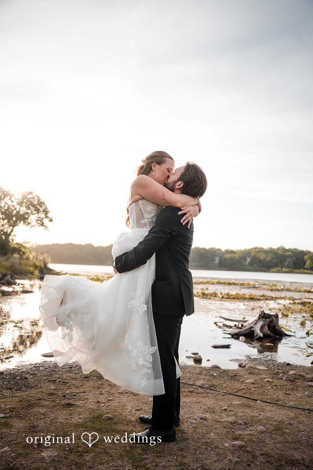 Groom lifting the bride