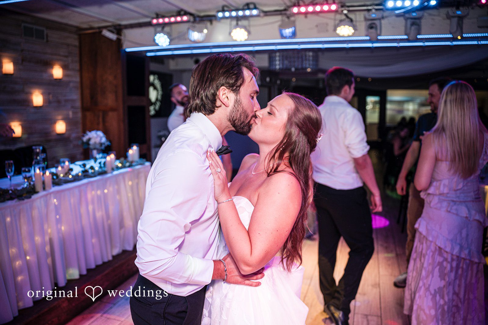 Couple dancing with guests