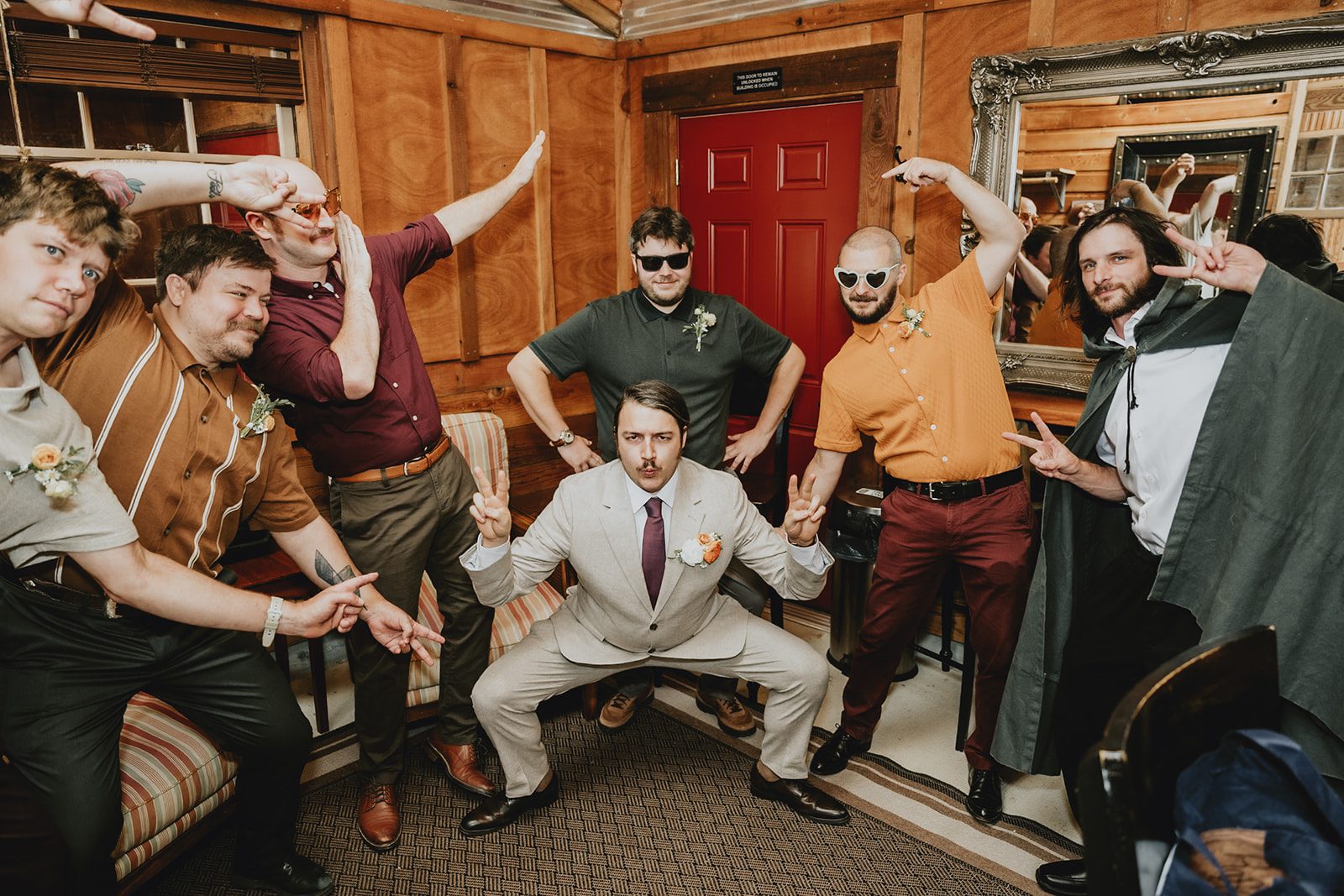 Groom with his groomsmen in the barn