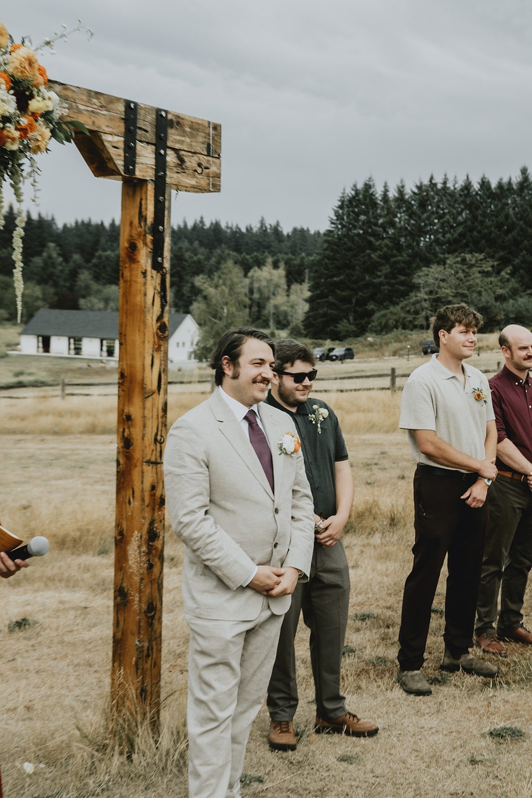 Groom at the ceremony arch