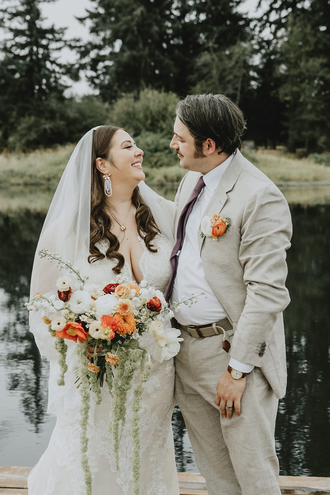 Bride and groom by the lake