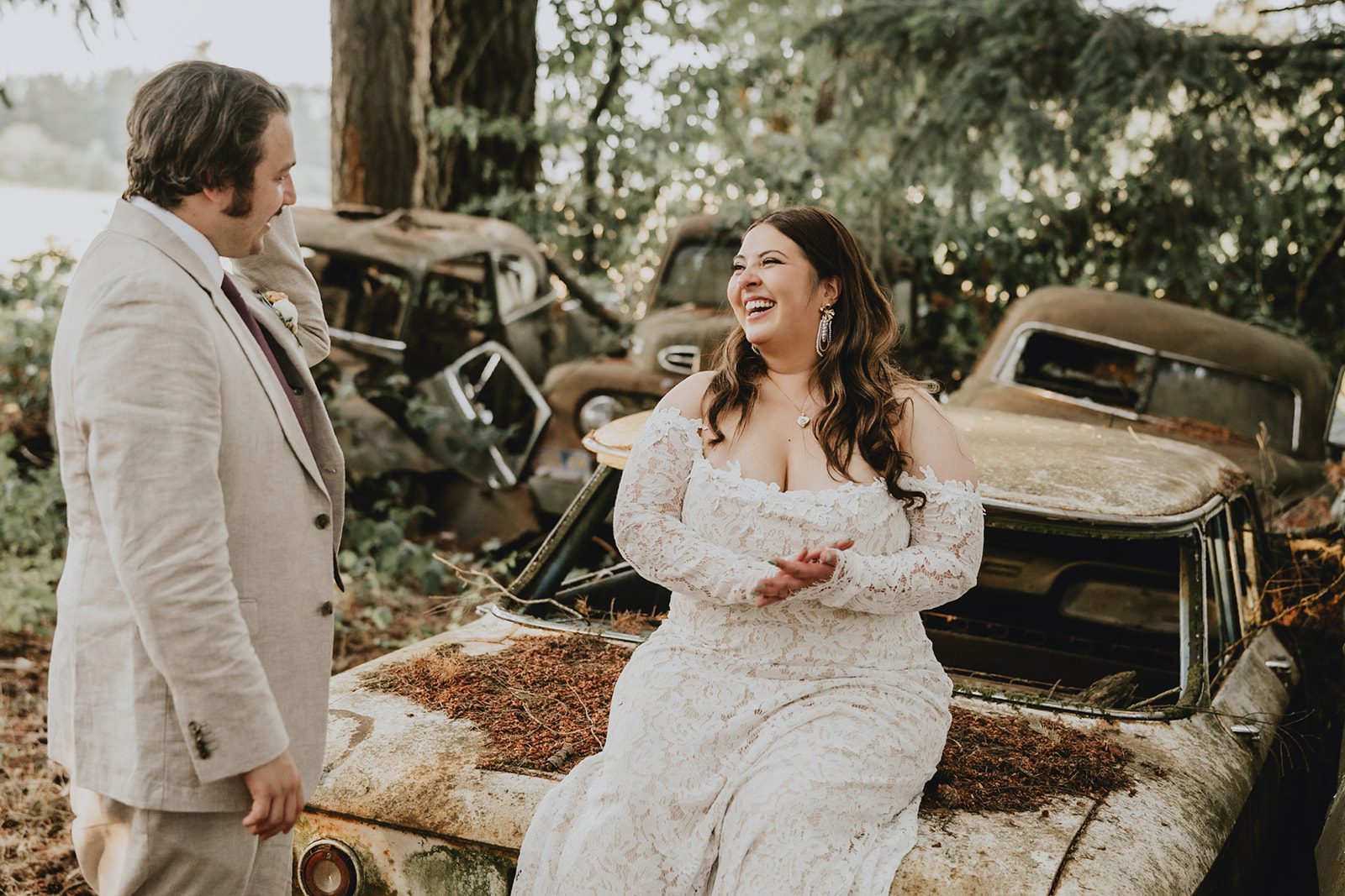 Bride and groom by an old truck