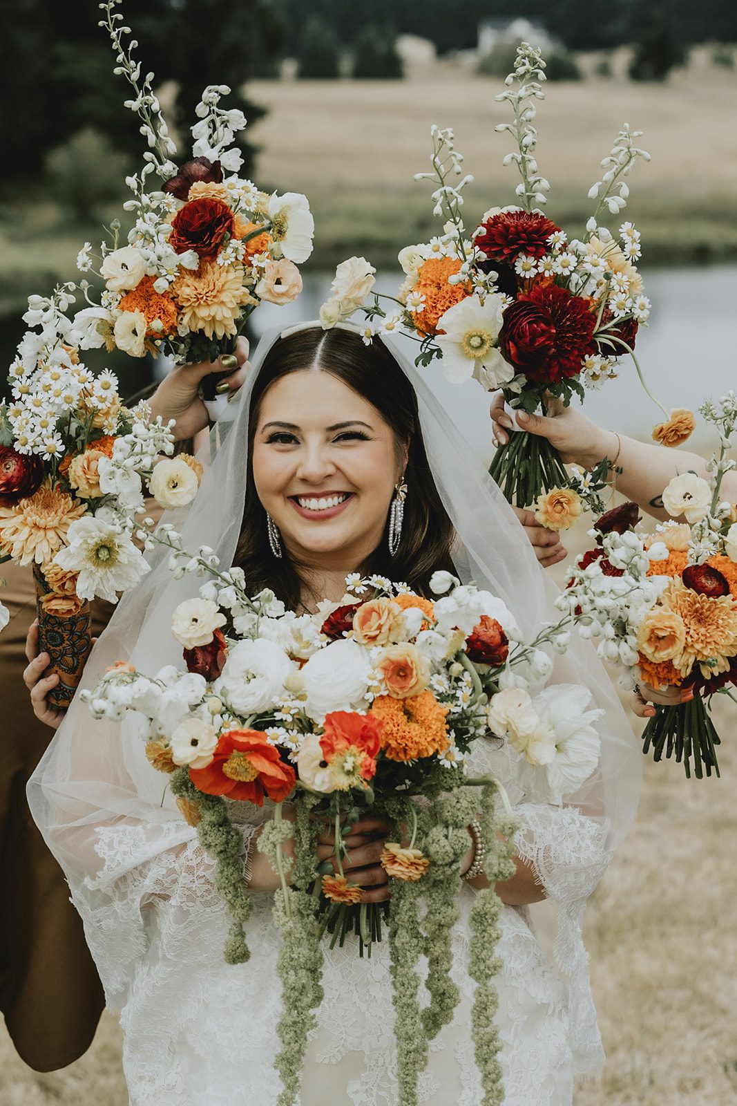 Bride with her bridesmaids and bouquets
