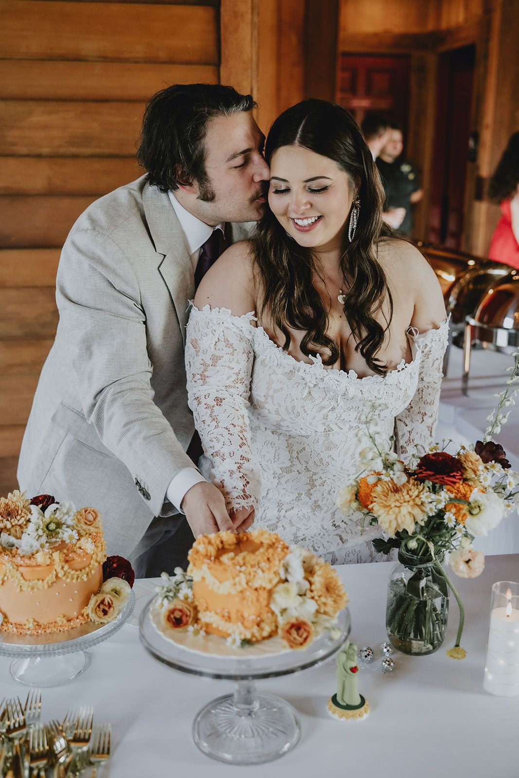 Couple cutting their wedding cake