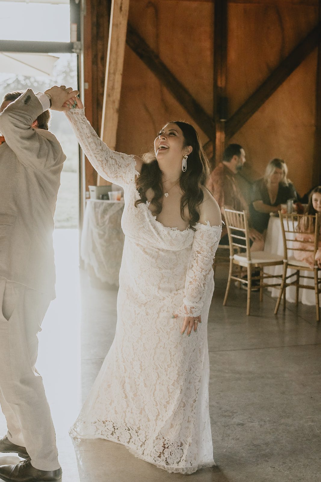 Bride dancing in the barn