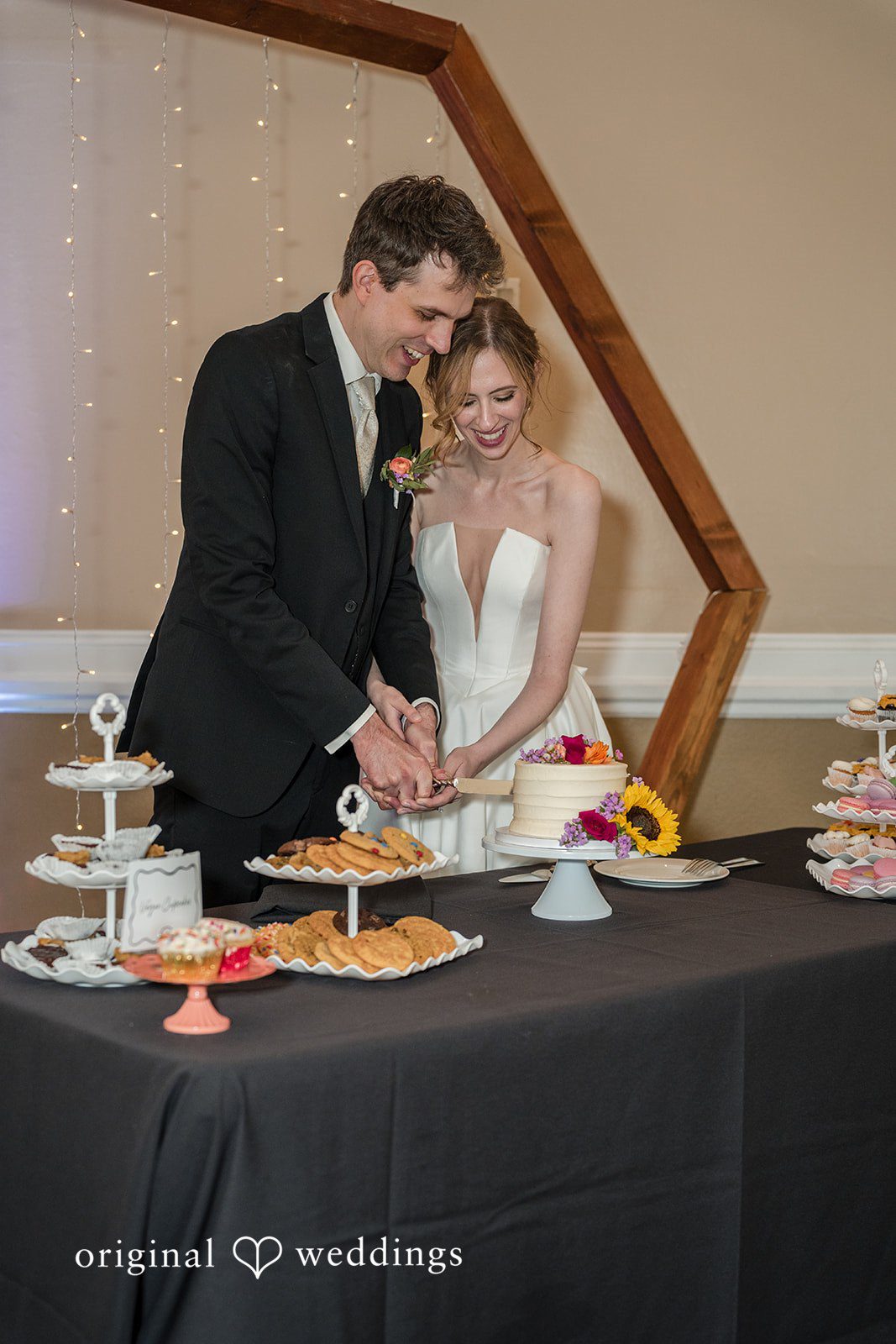 Jessica + James The couple cuts their wedding cake