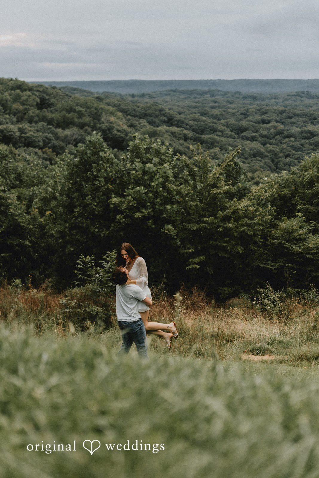 The groom carries the bride