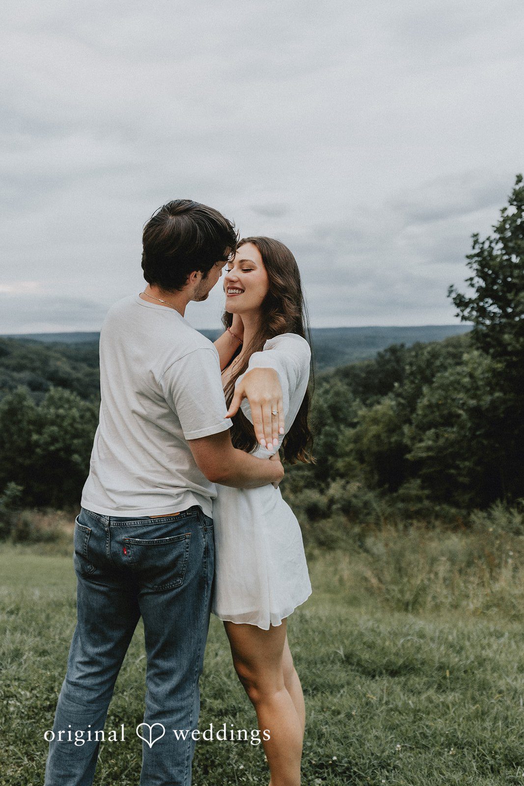The bride shows off her engagement ring