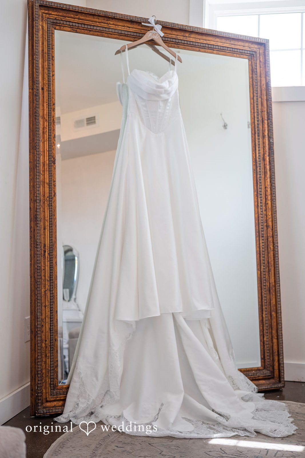 Wedding dress hanging in the bridal suite at Bryton Barn