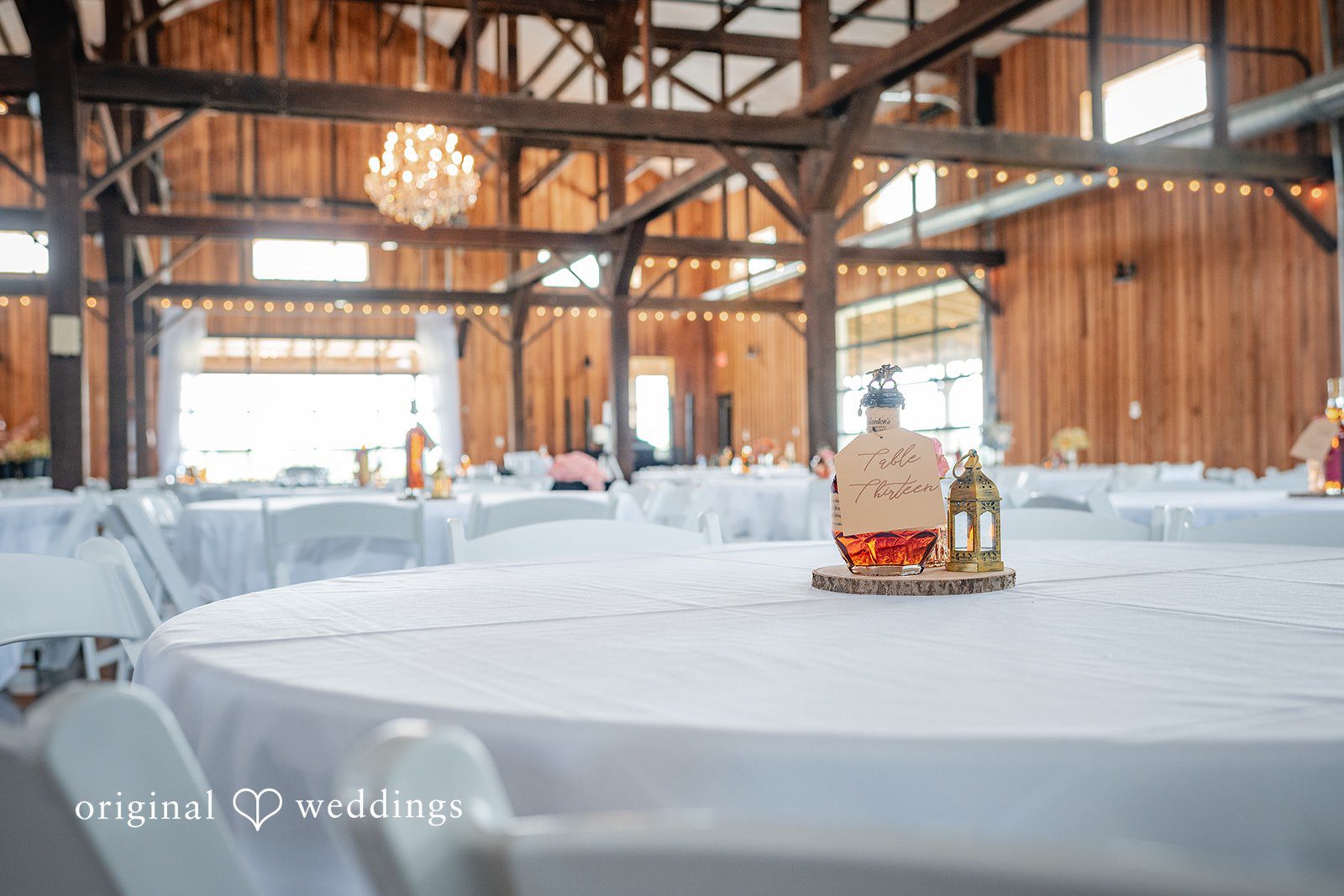 Reception tables set inside the barn at Bryton Barn