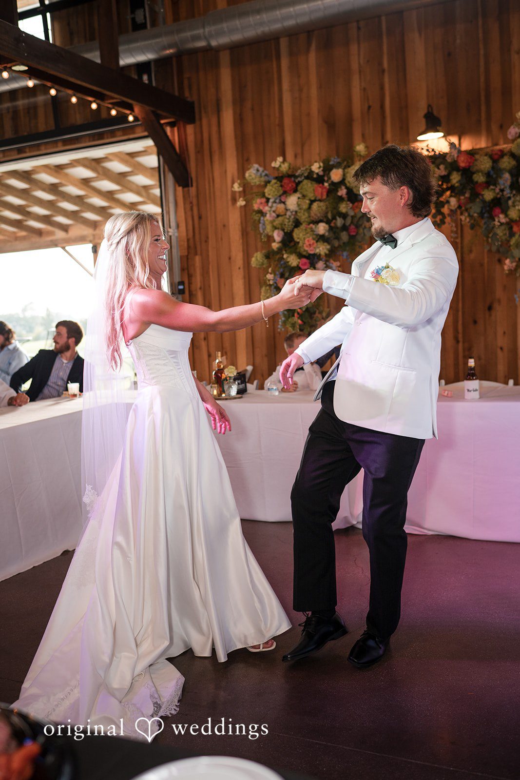 Couple dancing inside the barn