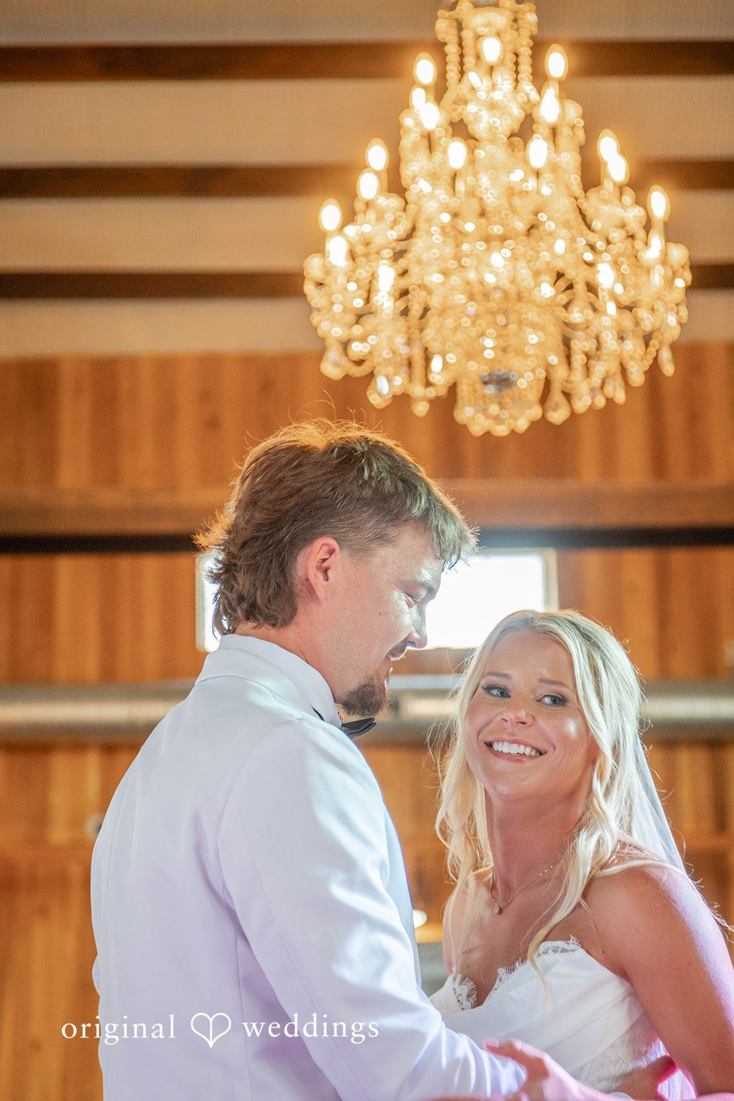 Couple sharing a quiet moment inside the barn