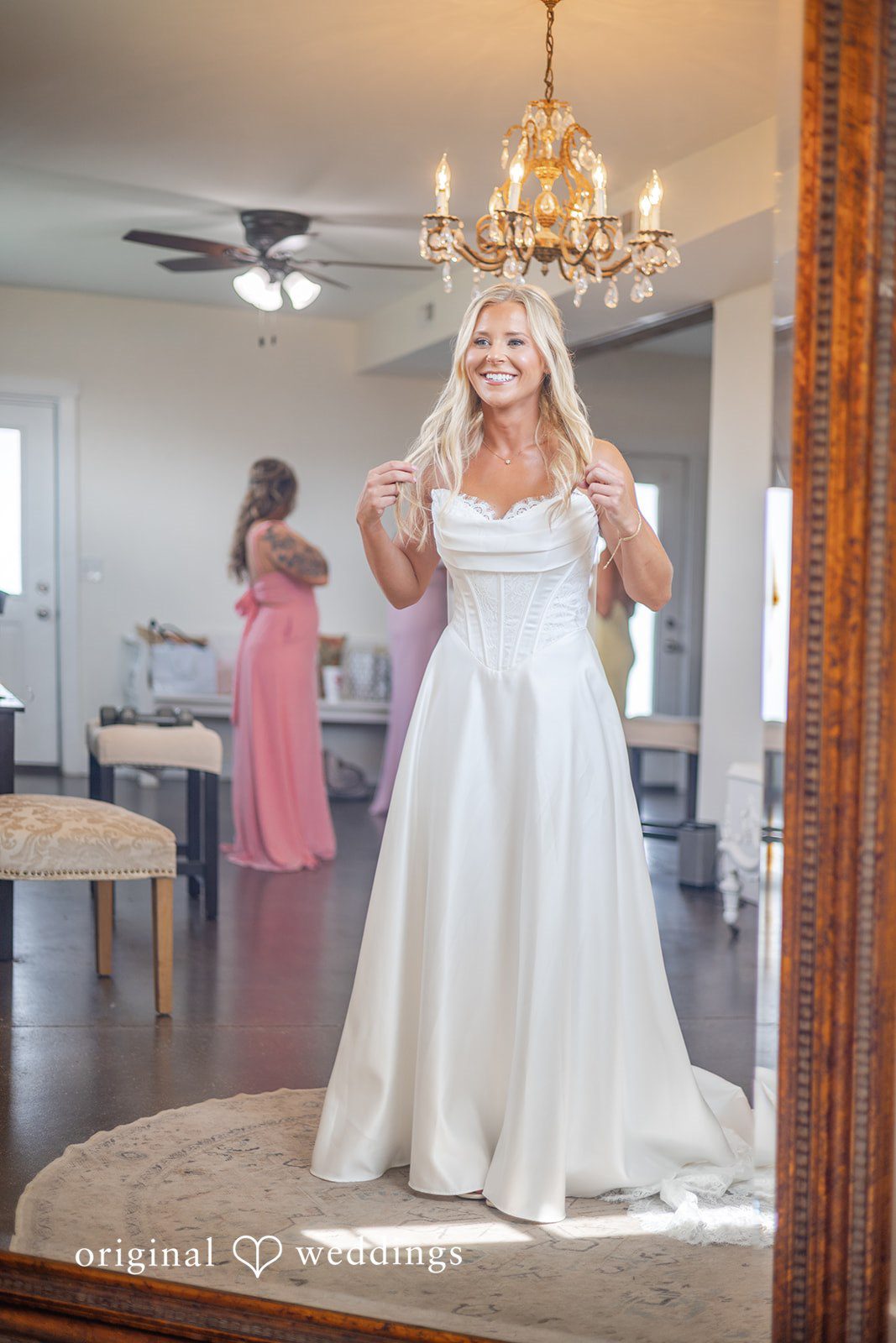 Bride posing in the barn doorway at Bryton Barn