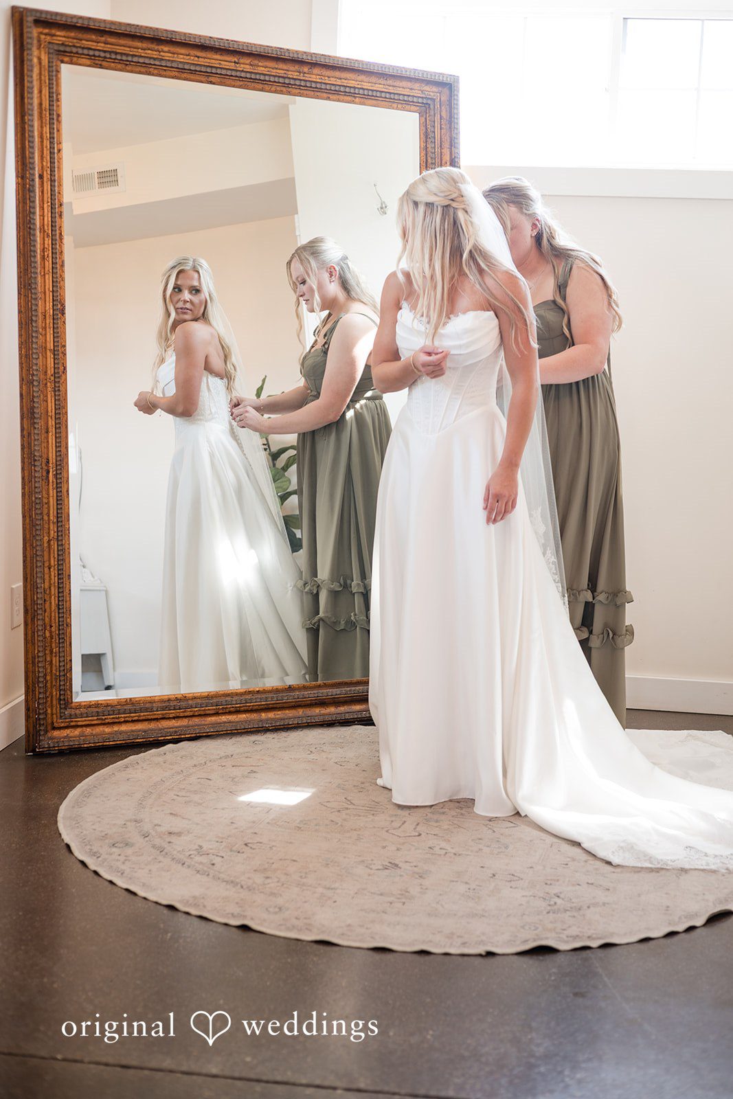 Bride checking her look in the mirror