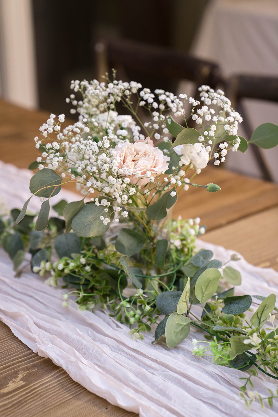 Table runner with white flowers and candles