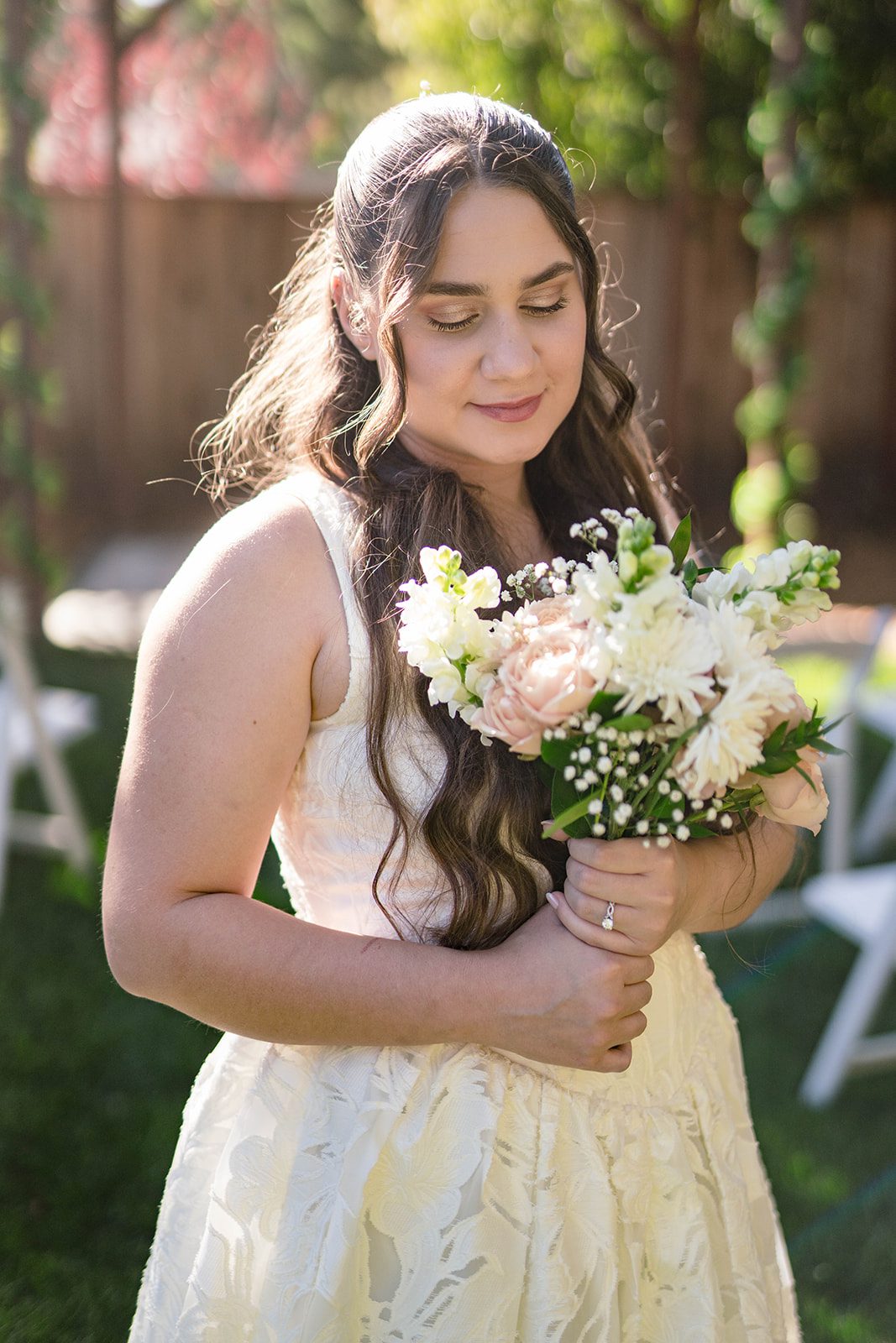 Bride smiling with her bouquet