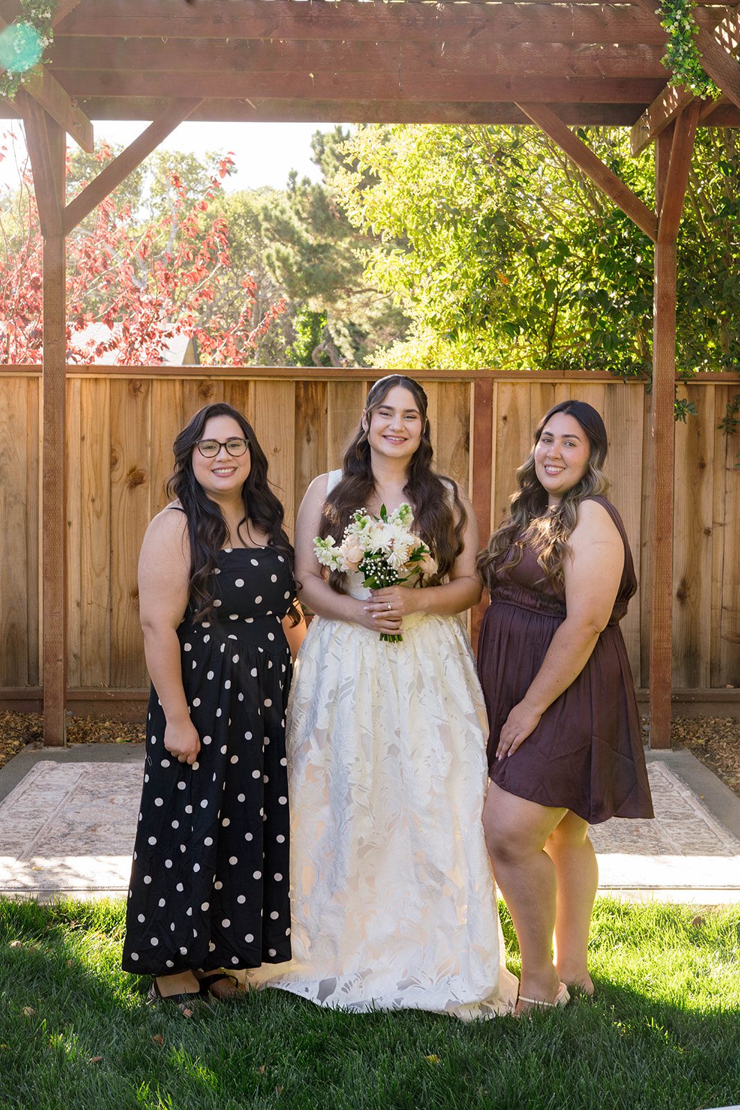 Bride with her bridesmaids at a California backyard wedding