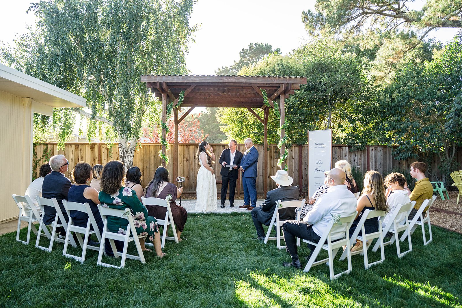 Guests gathered for the outdoor ceremony at a California backyard wedding