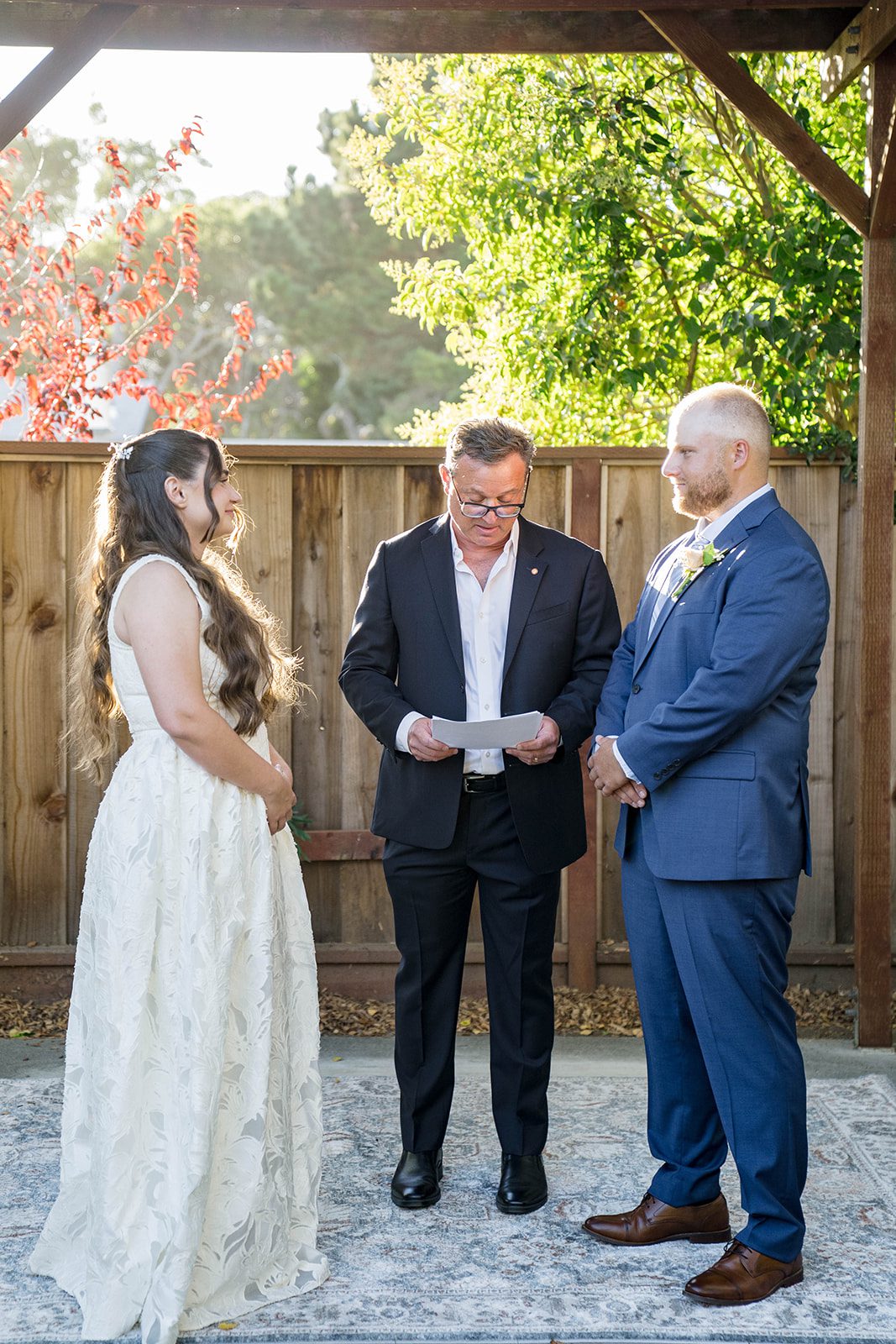 Couple exchanging vows with the officiant