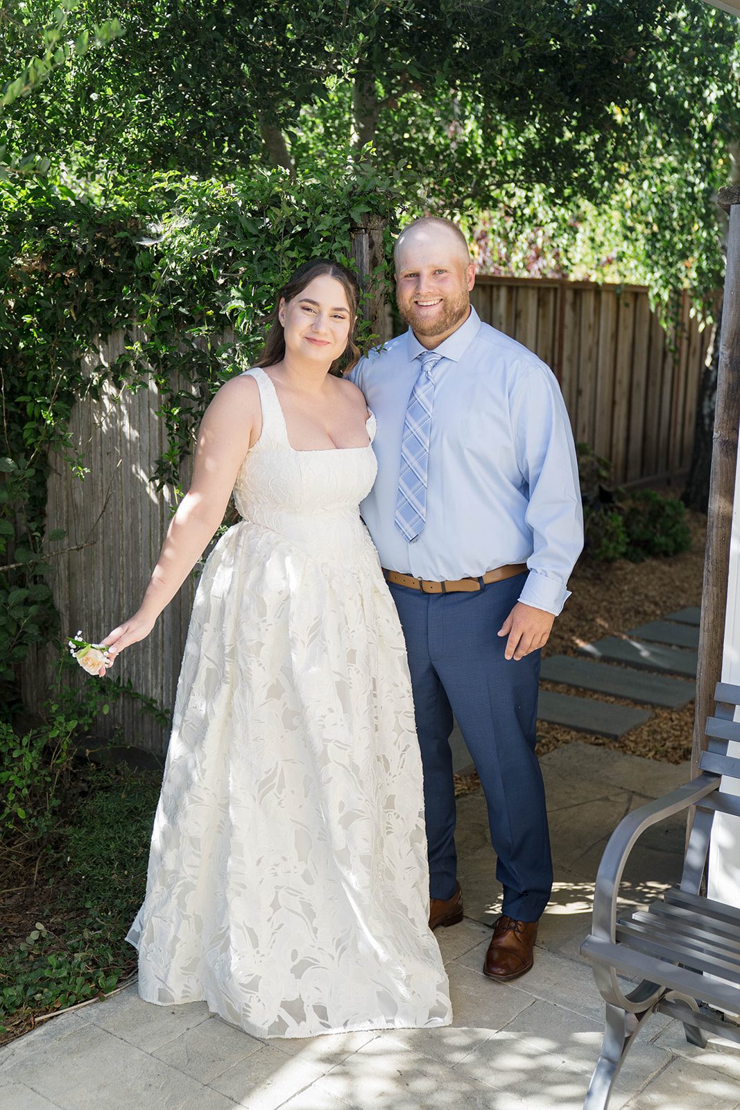 Bride and groom together in the garden