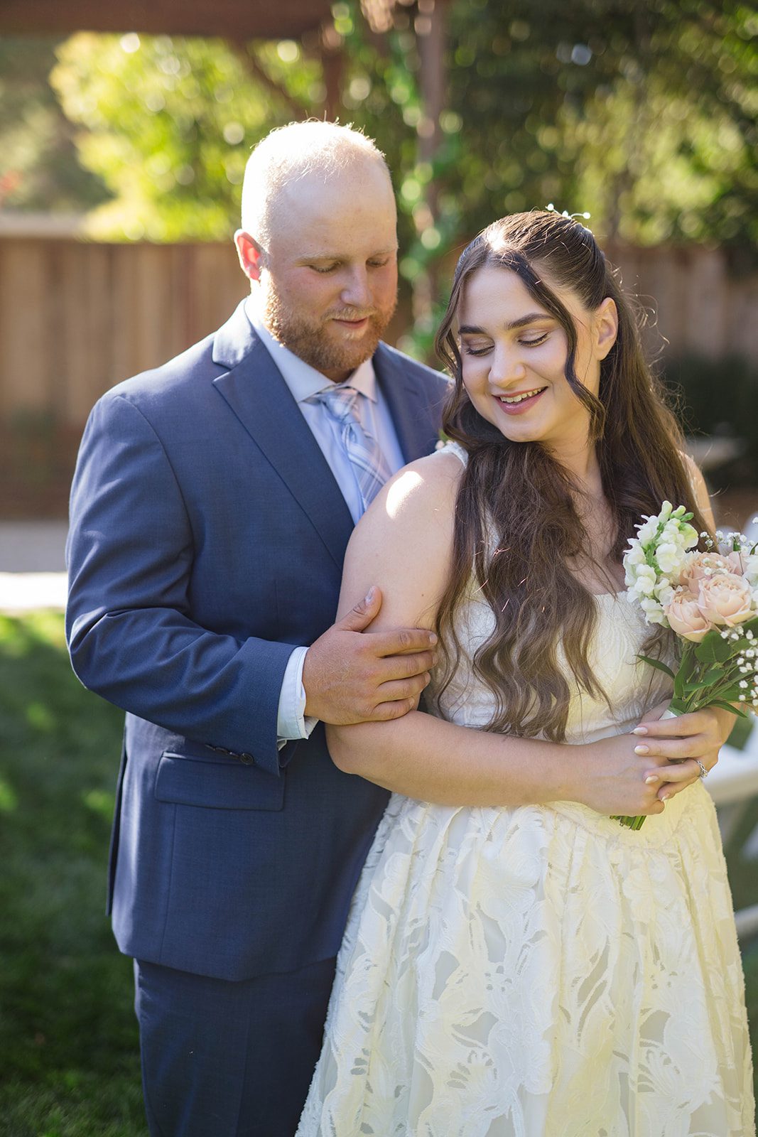 Groom holding the bride close