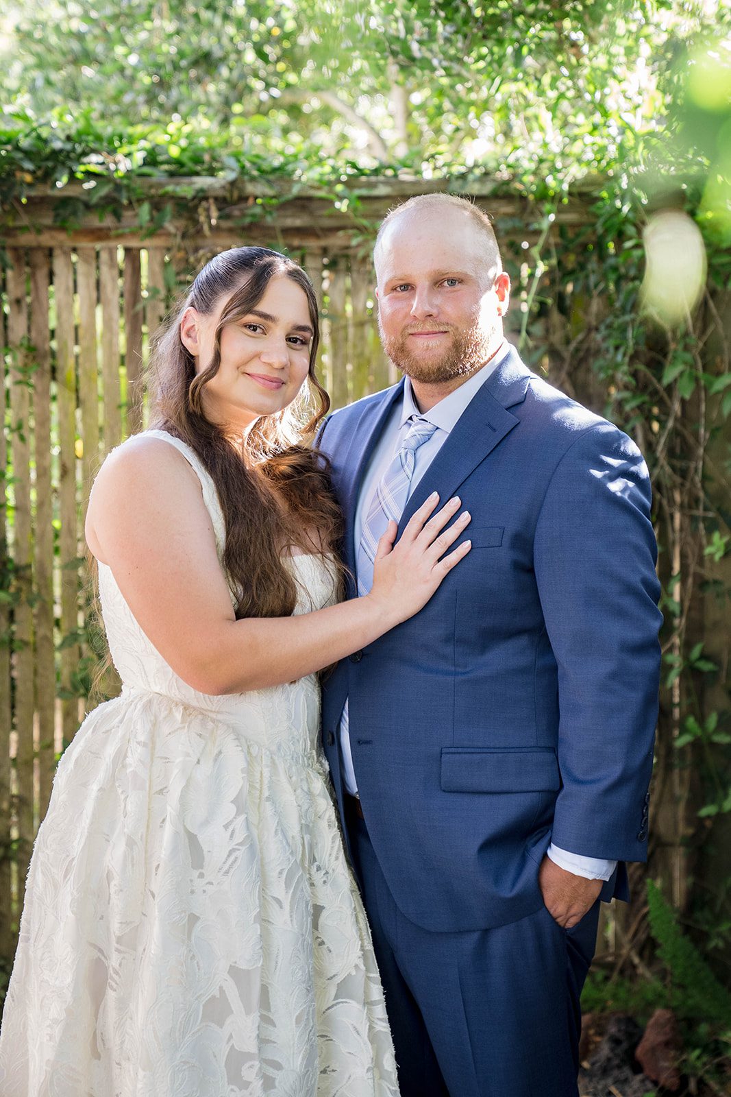 Bride and groom side by side in the yard at a California backyard wedding