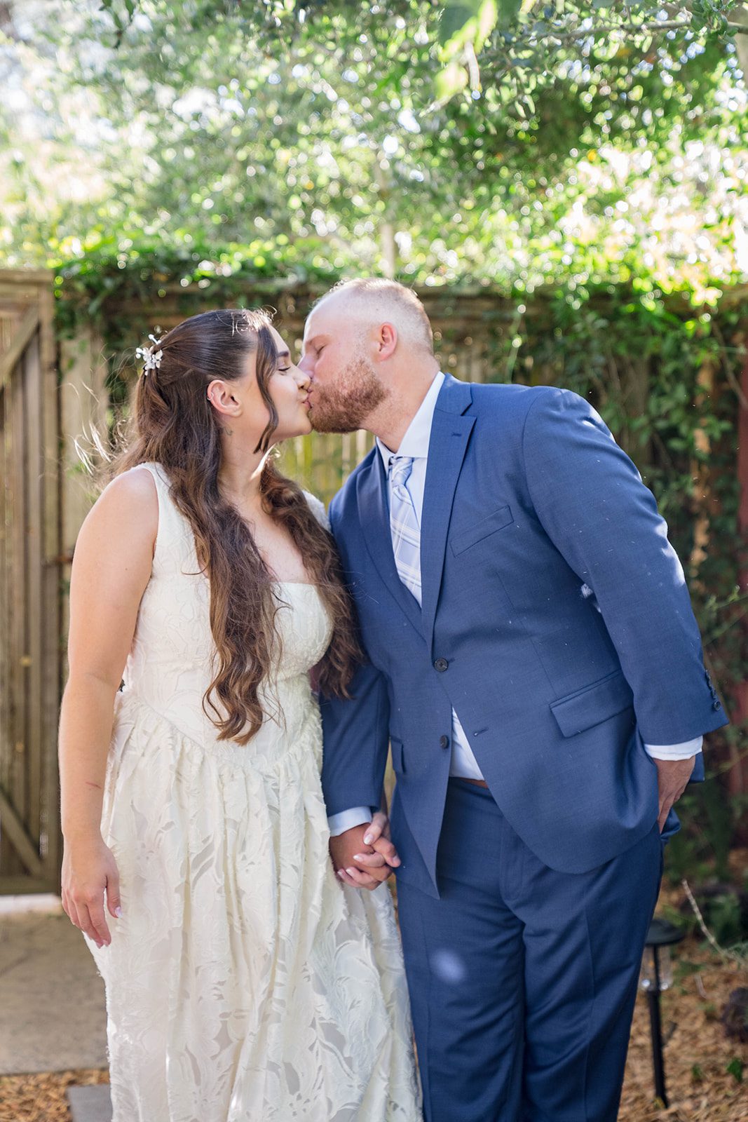 Groom kissing the bride on the cheek