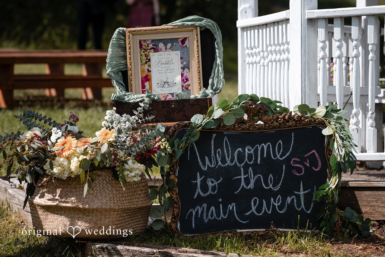 Welcome sign with flowers by Philadelphia wedding photographers at Camp Kweebec