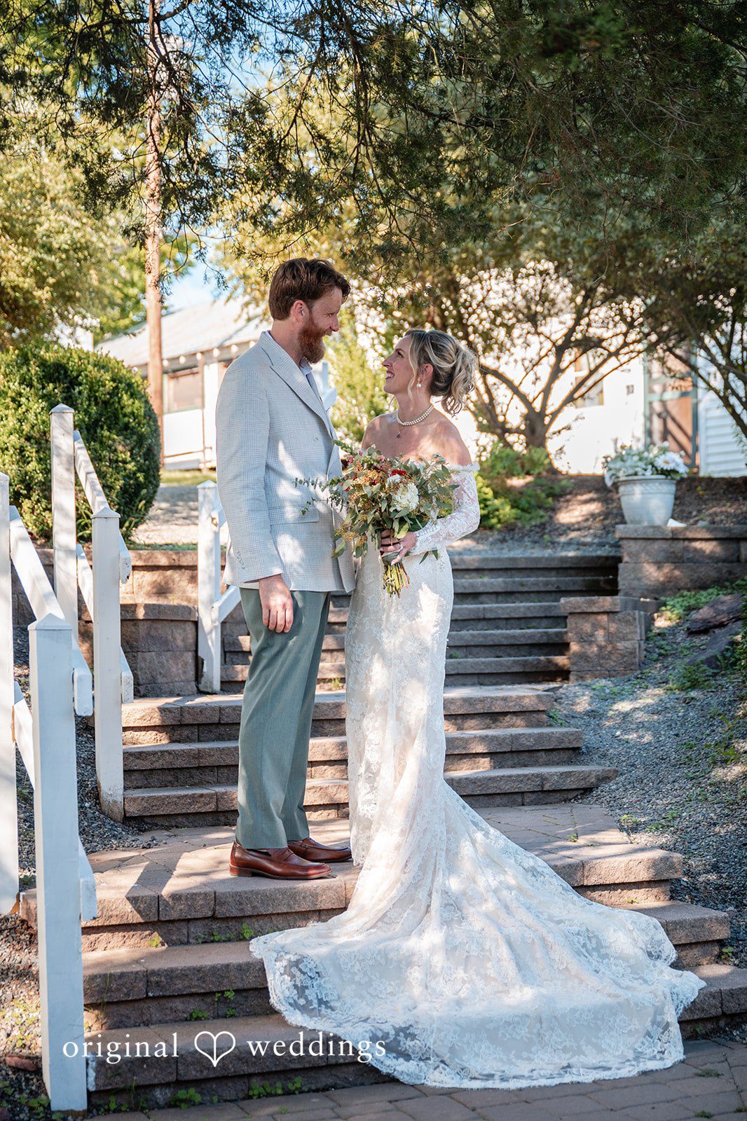 Couple on the stairs with the train at Camp Kweebec