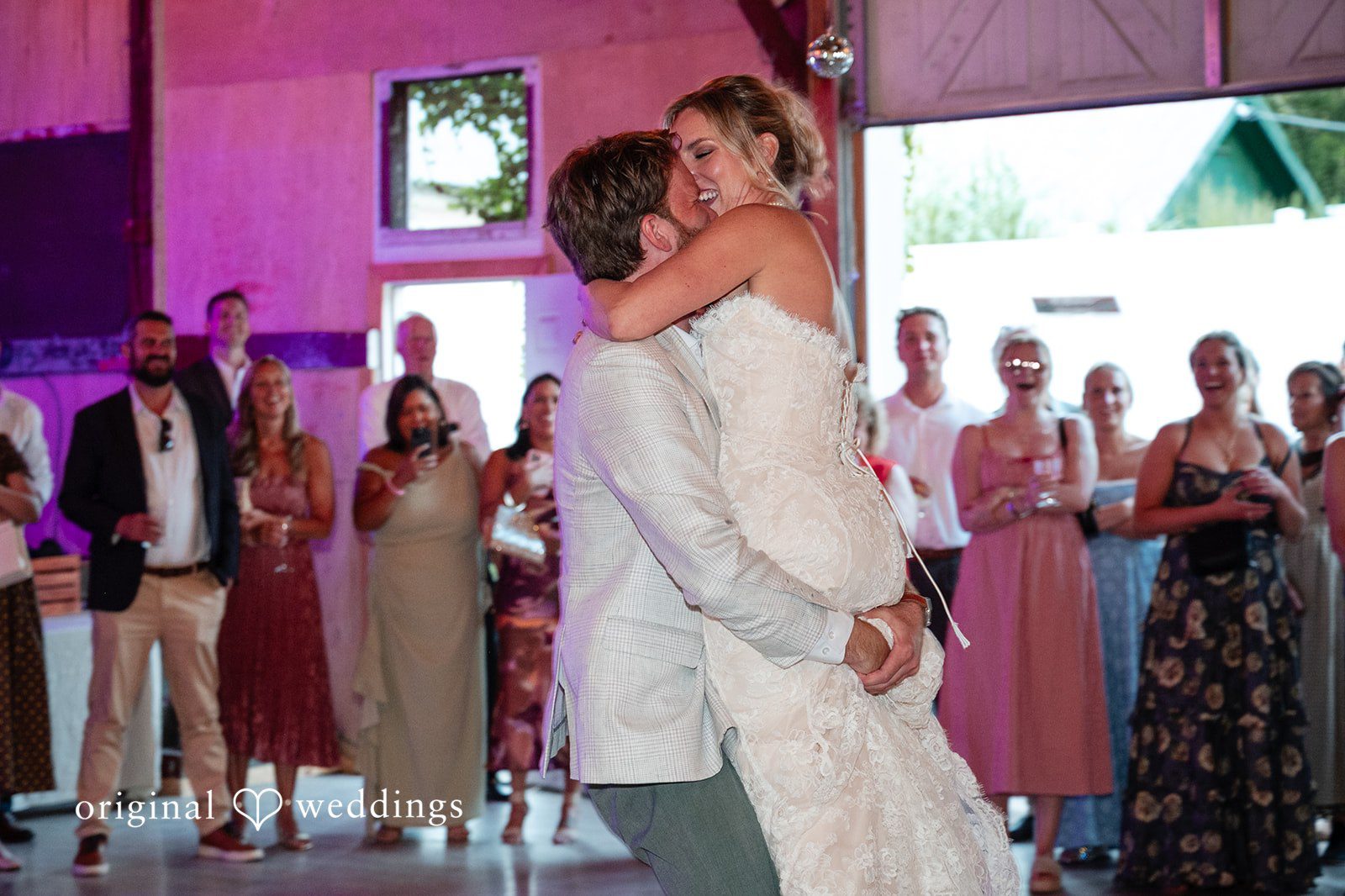 Couple dancing under colored lights