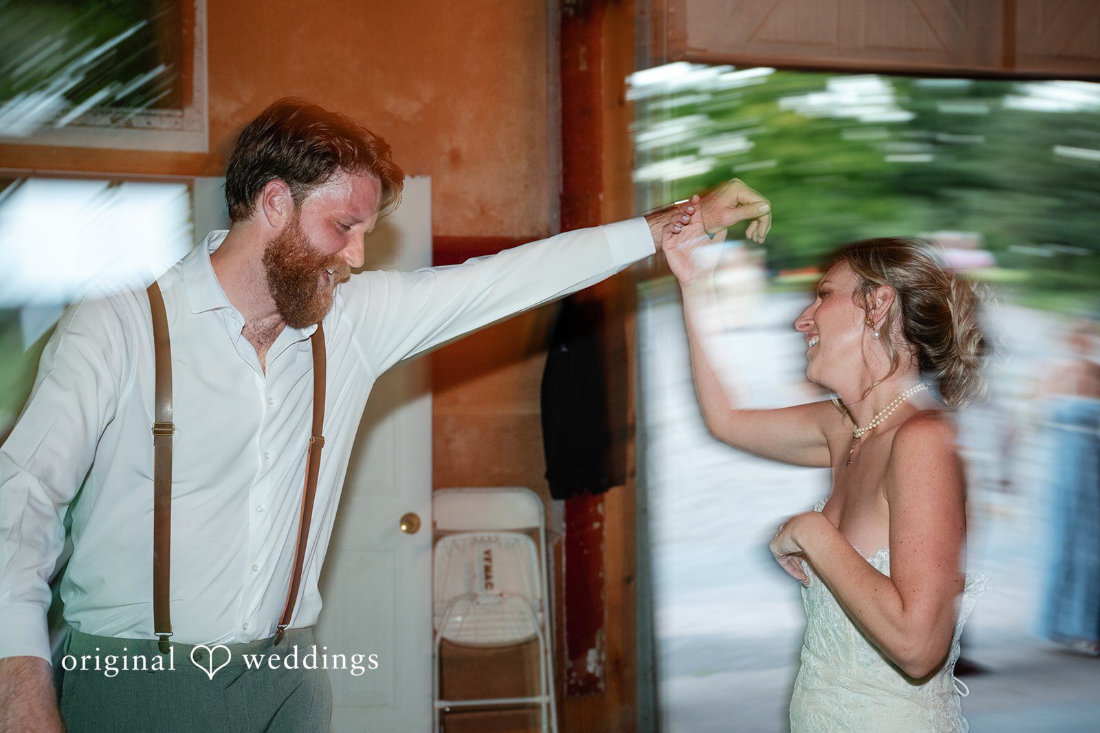 Groom dancing with a guest