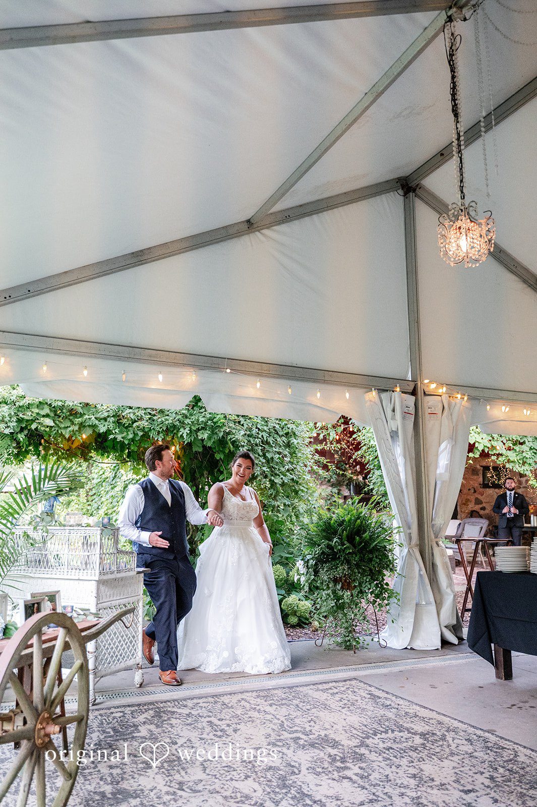 The couple makes an entrance into their wedding reception