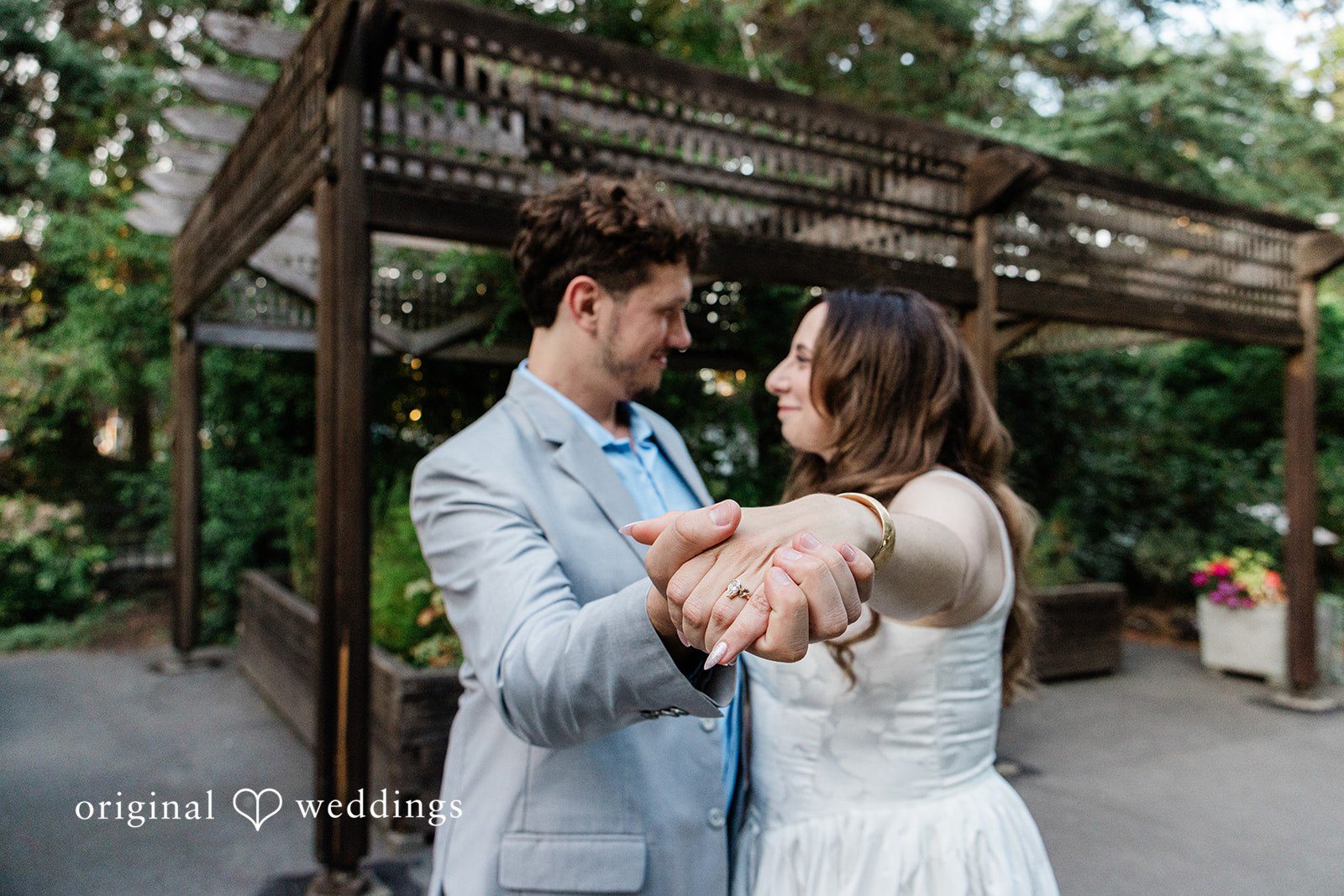 Rachel + Neil The couple shows off the bride's engagement ring