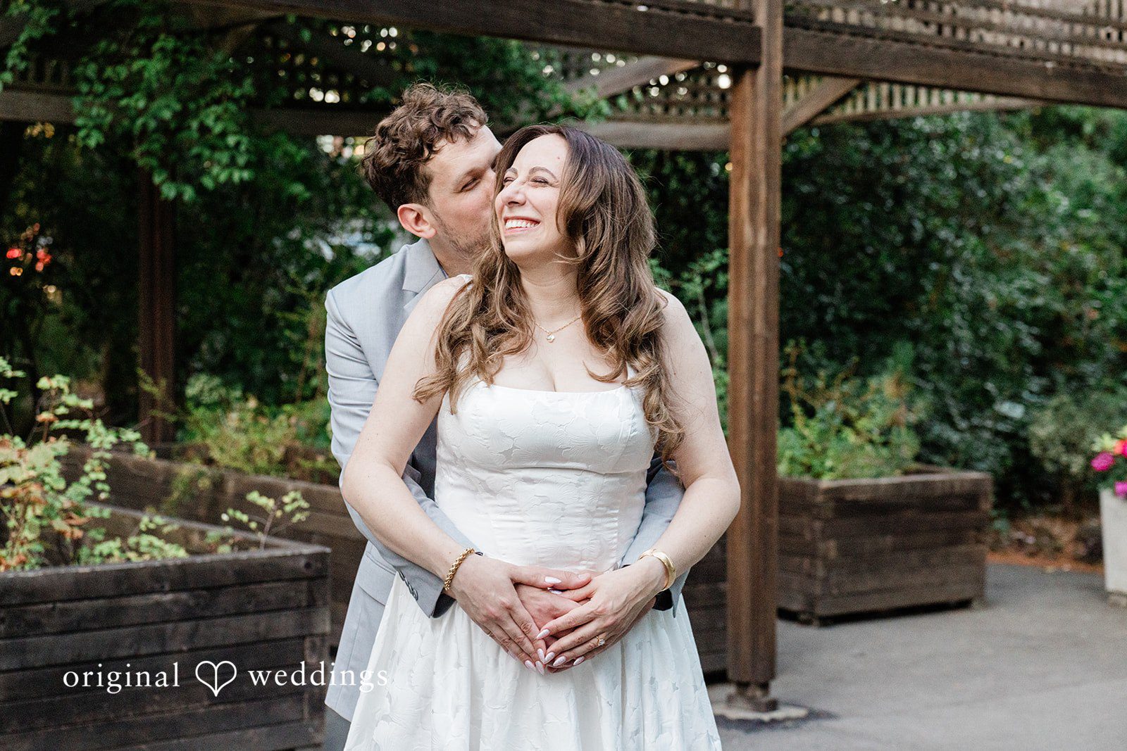 Rachel + Neil The groom pecks his bride