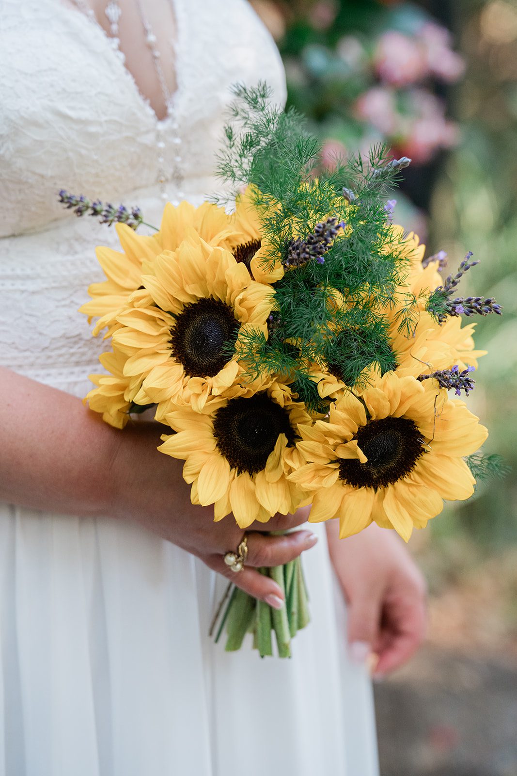chatfield-farms-airy-denver-june-logan-004-20 Bride holding her sunflower bouquet