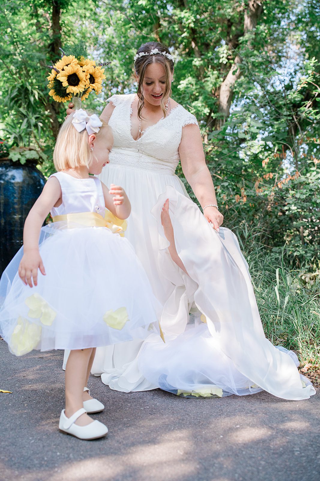 chatfield-farms-airy-denver-june-logan-006-07 Bride and flower girl sharing a sweet moment