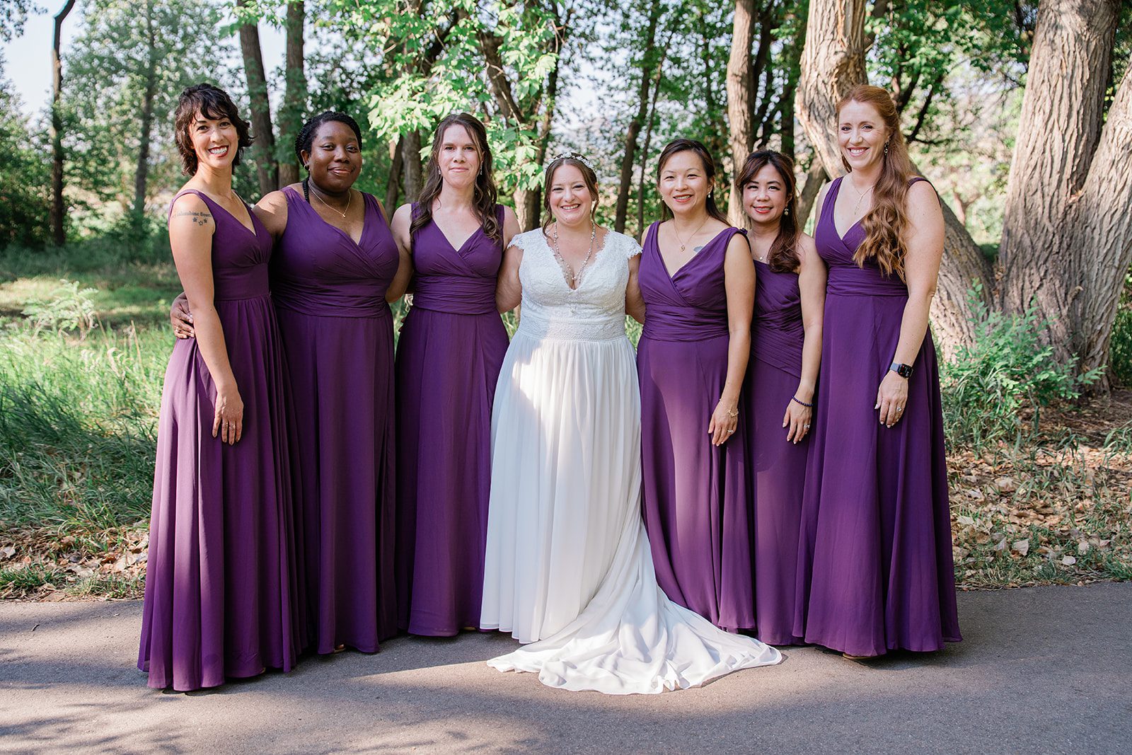 chatfield-farms-airy-denver-june-logan-007-17 Bride with her bridesmaids in purple at Chatfield Farms